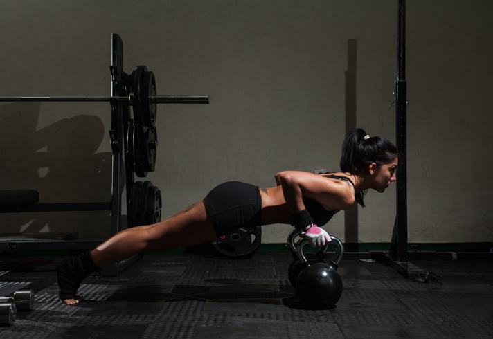 woman-gym-training-kettlebells